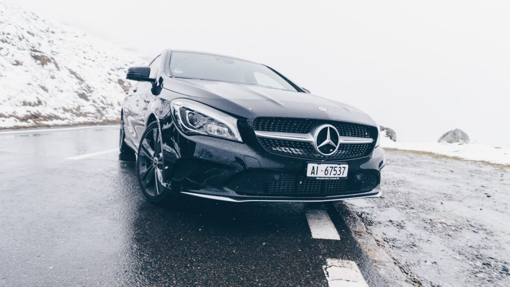black Mercedes-Benz car on grey concrete surface taxi winterthur