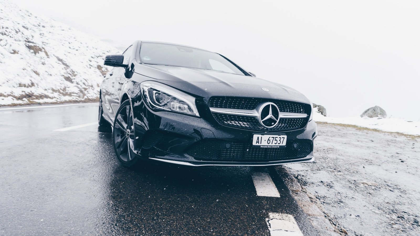 black Mercedes-Benz car on grey concrete surface taxi winterthur